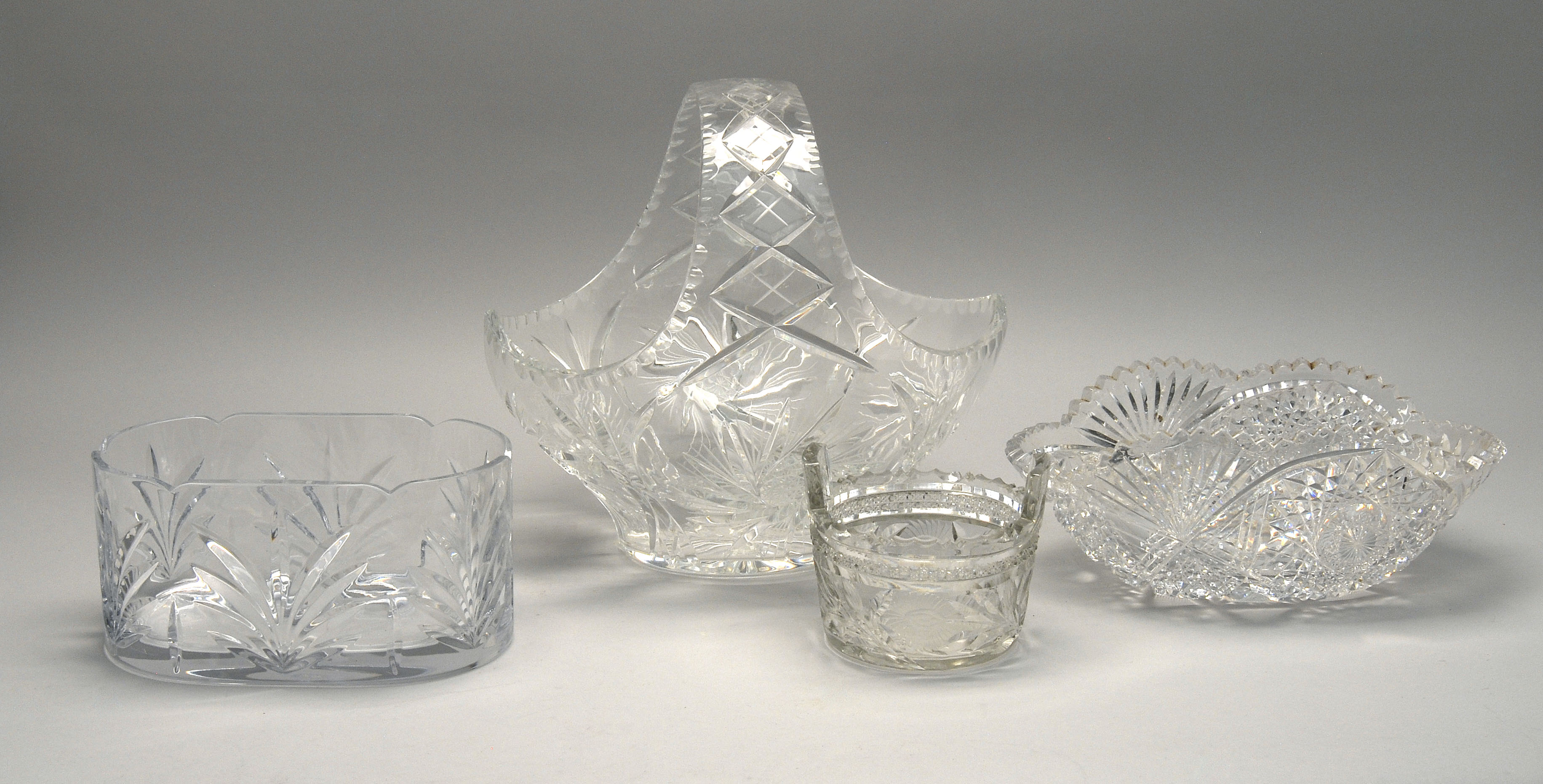 Appraisal: FOUR PIECES OF CUT GLASS oval bowl in Starburst pattern