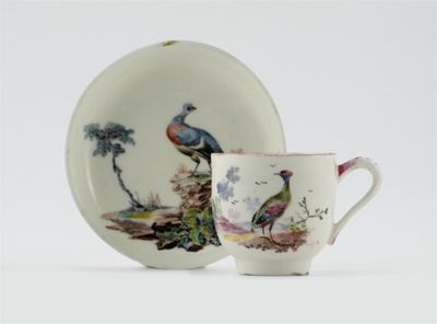 Appraisal: A Mennecy cup and associated saucer painted with colourful birds