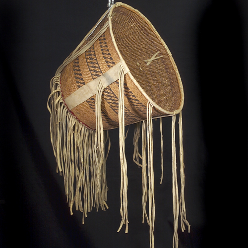 Appraisal: Early c ceremonial basket decorated with elk skin fringe and