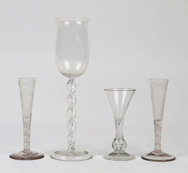 Appraisal: A PAIR OF TH CENTURY GLASS FLUTES with engraved foliate