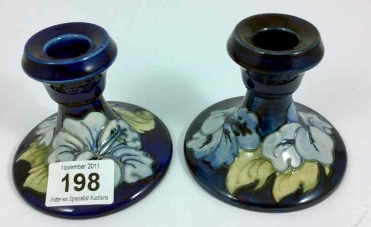 Appraisal: Moorcroft Pair of Candlesticks decorated with the Hibiscus design on