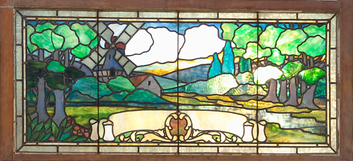 Appraisal: ARTS CRAFTS Stained-glass window depicting a landscape with a windmill