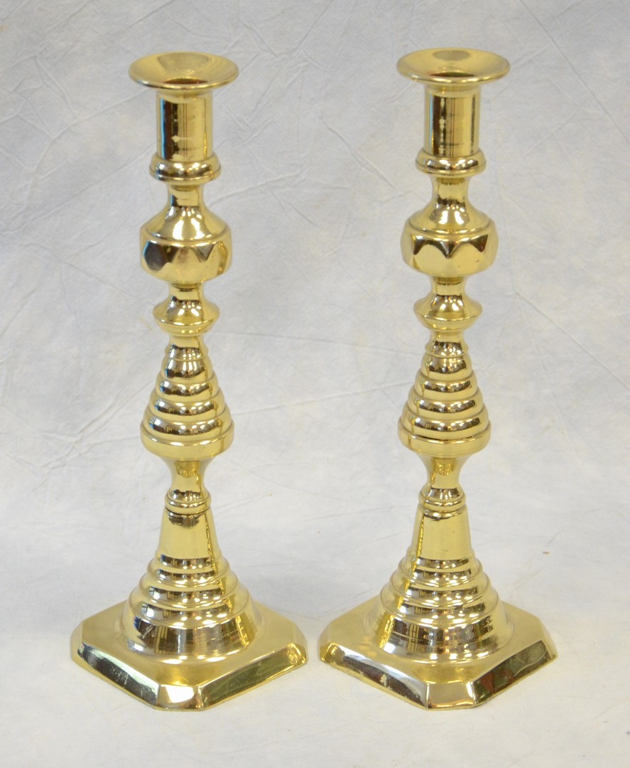 Appraisal: Pair of brass push-up candlesticks one push-up missing beehive form