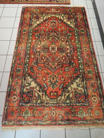 Appraisal: Heriz Persian Handmade Rug central medallion stylized floral border earthtones