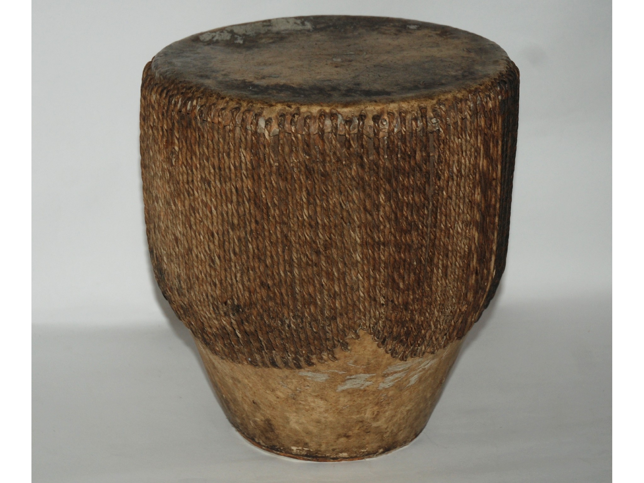 Appraisal: A tribal drum with hide skin