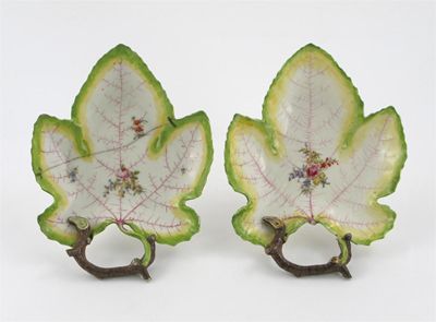 Appraisal: A pair of Chelsea vine leaf dishes each painted with