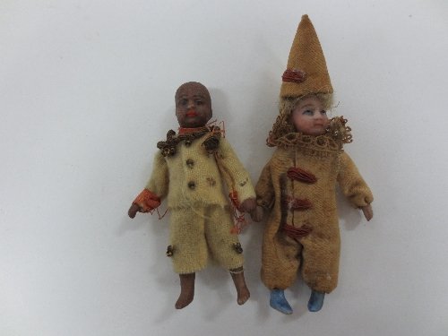 Appraisal: A small jester doll with bisque head hands and feet