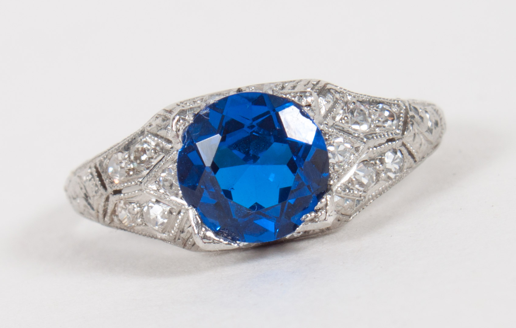 Appraisal: Lady's platinum and diamond ring with center synthetic blue stone