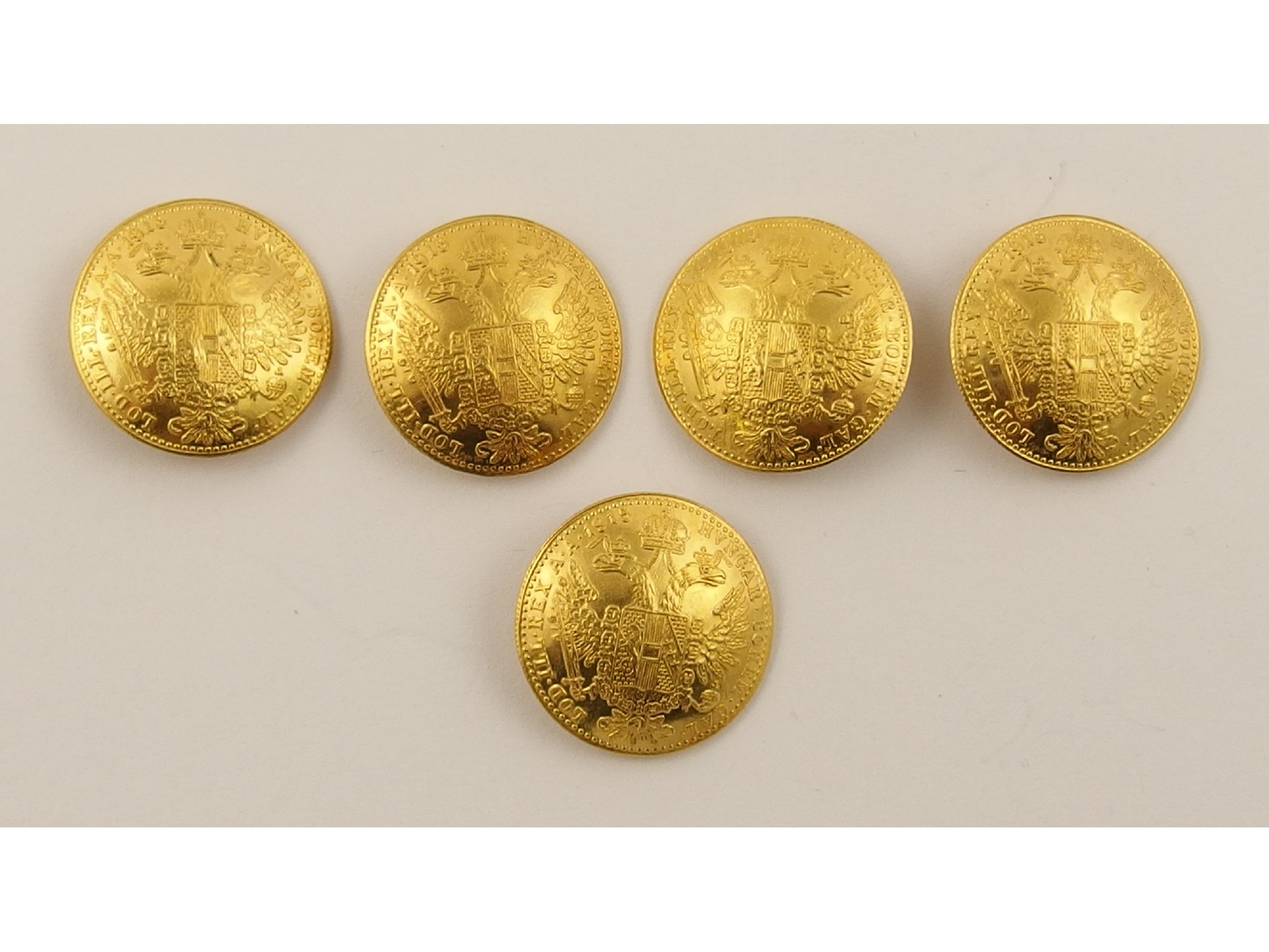 Appraisal: Five Austrian Franz Joseph Kronen gold coins made into buttons