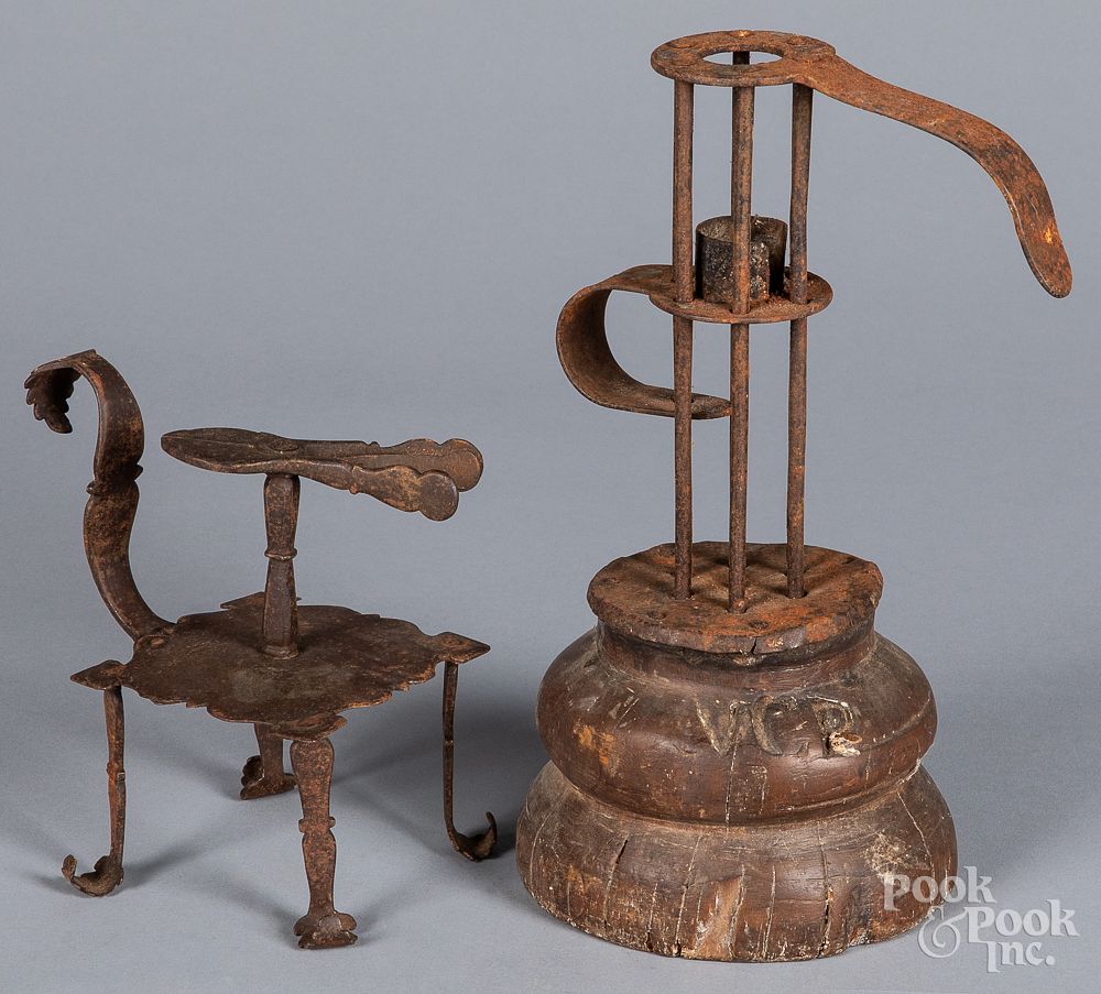 Appraisal: Wrought iron wax jack and push-up candlestick Wrought iron wax