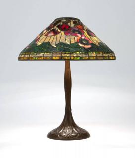 Appraisal: A Buffalo Studios patinated bronze leaded glass lamp Circa impressed