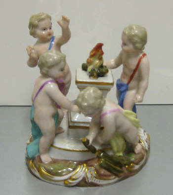 Appraisal: MEISSEN PORCELAIN MINIATURE FIGURE GROUP Four putti standing around an