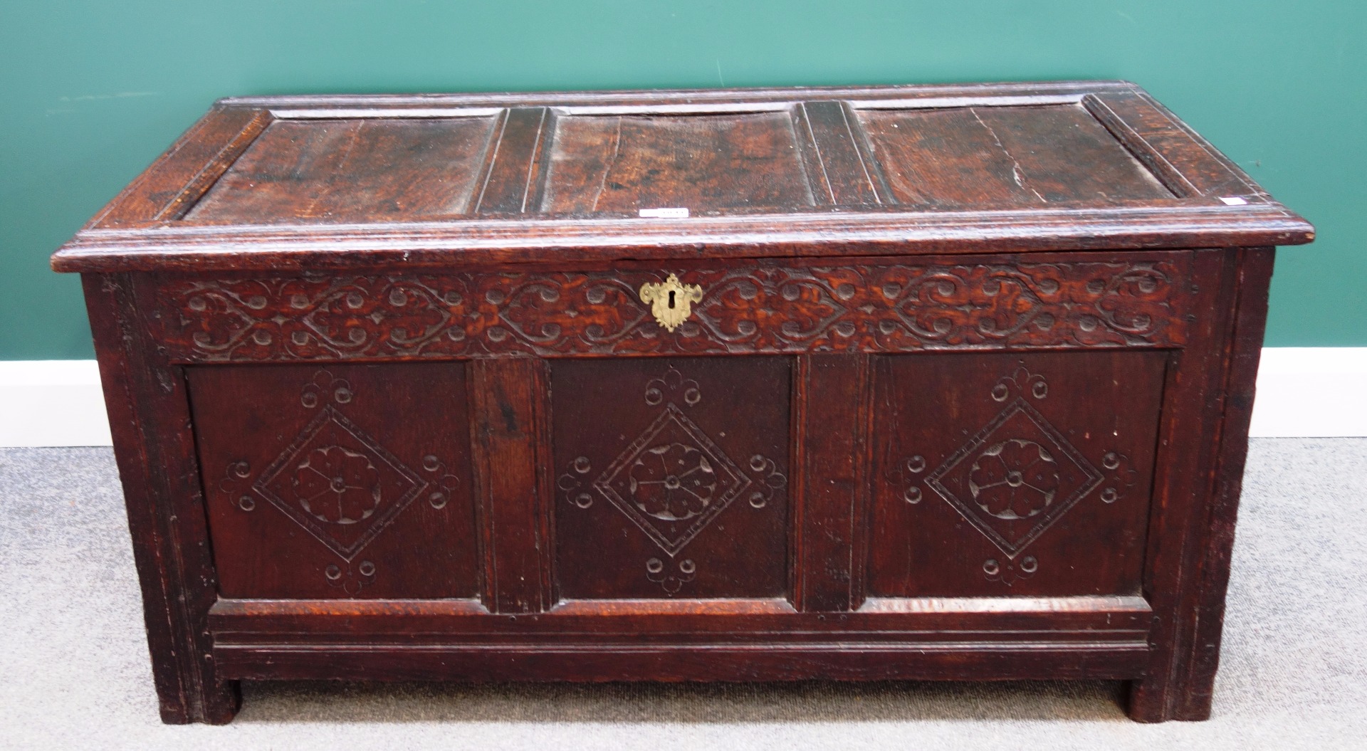 Appraisal: A th century oak triple panel coffer with carved decoration