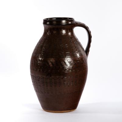 Appraisal: Gwyn Hanssen Pigott Australian - a textured pitcher in chestnut