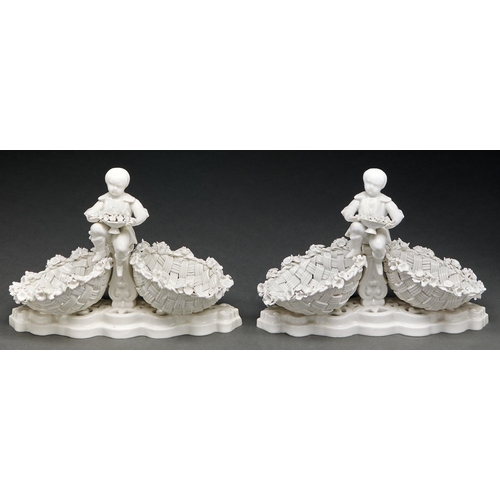 Appraisal: A pair of Continental glazed porcelain child figural double basket