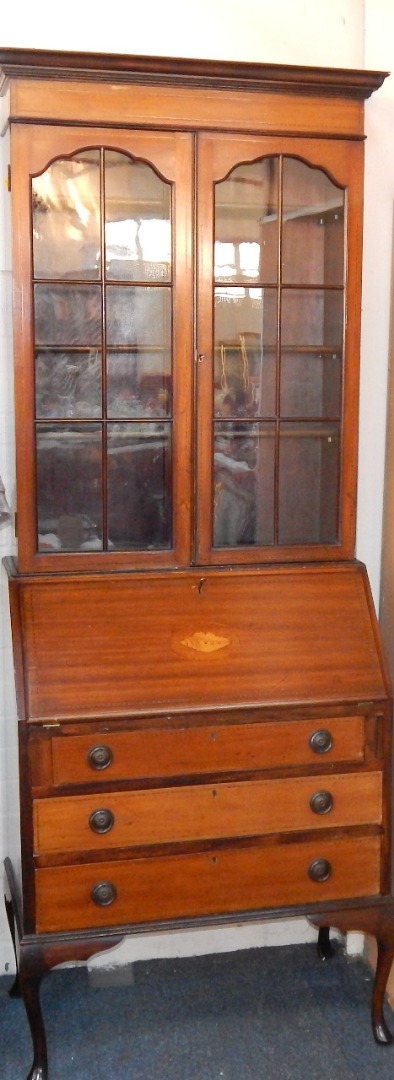 Appraisal: A mahogany and inlaid bureau bookcase early th C the