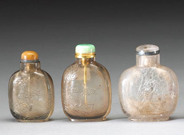 Appraisal: Three carved rock crystal snuff bottles Each carved in delicate