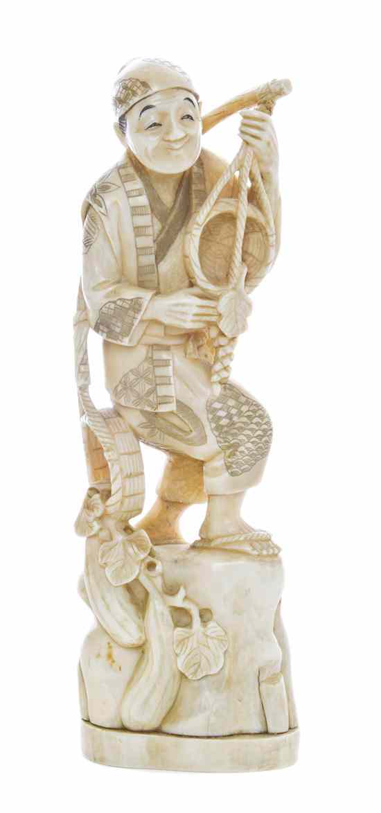 Appraisal: A Japanese Carved Ivory Okimono depicting a man standing with