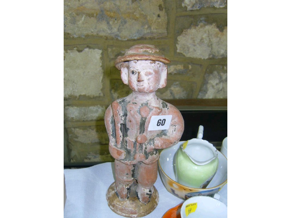 Appraisal: An early th century terracotta figure of a standing Tommy