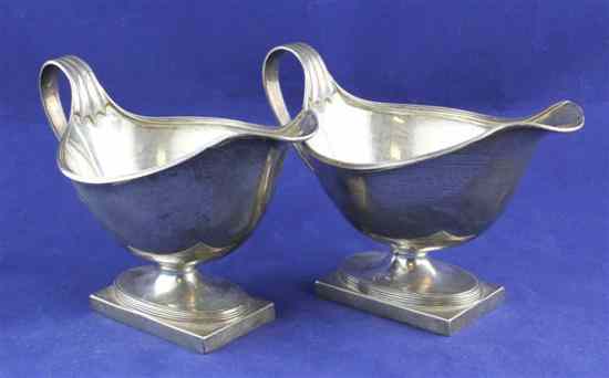 Appraisal: A pair of George V silver sauce boats with reeded