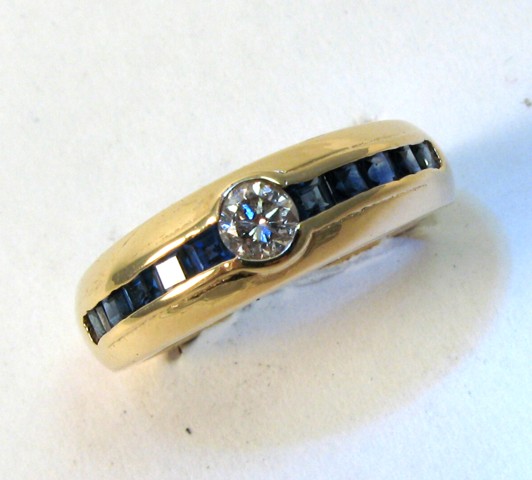 Appraisal: SAPPHIRE DIAMOND AND YELLOW GOLD RING The k gold band