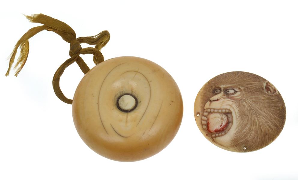 Appraisal: JAPANESE IVORY MEIJI MANJU NETSUKE TOGETHER WITH CARVED IVORY DISC