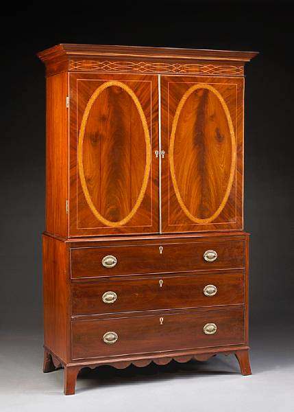 Appraisal: A George III inlaid mahogany linen press late th century