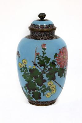 Appraisal: A Japanese cloisonn jar and cover decorated chrysanthemums and butterflies