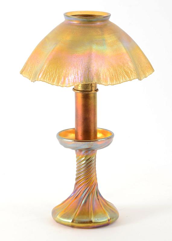 Appraisal: TIFFANY FAVRILE CANDLESTICK LAMP Favrile glass base with twist marked