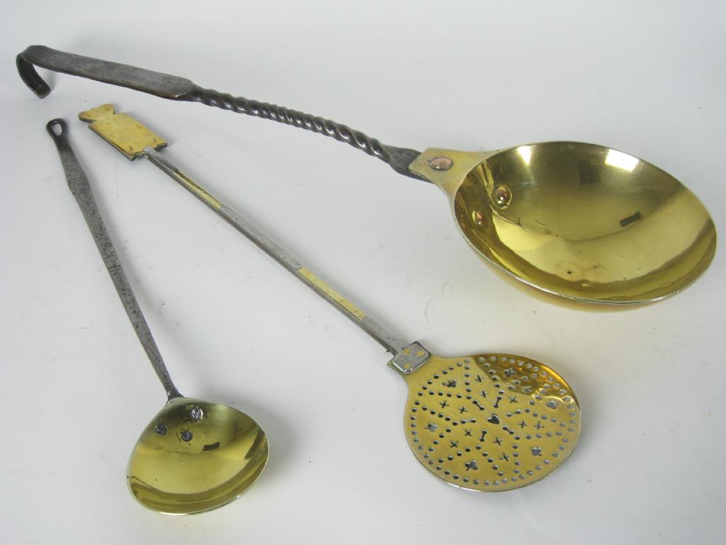 Appraisal: An th Kitchen Ladle with iron handle and small brass