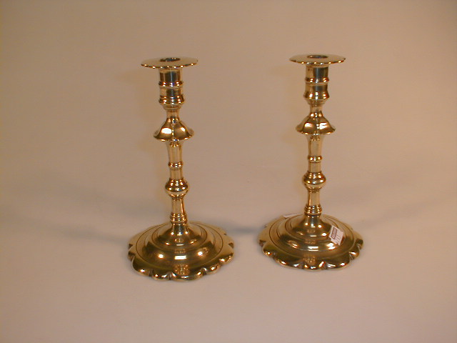 Appraisal: A pair of late thC cast brass candlesticks in the