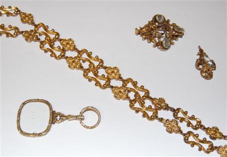 Appraisal: A Victorian gilt metal chain composed fancy scroll and floral