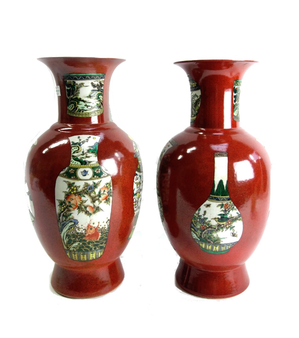 Appraisal: A pair of modern Chinese porcelain vases decorated with further