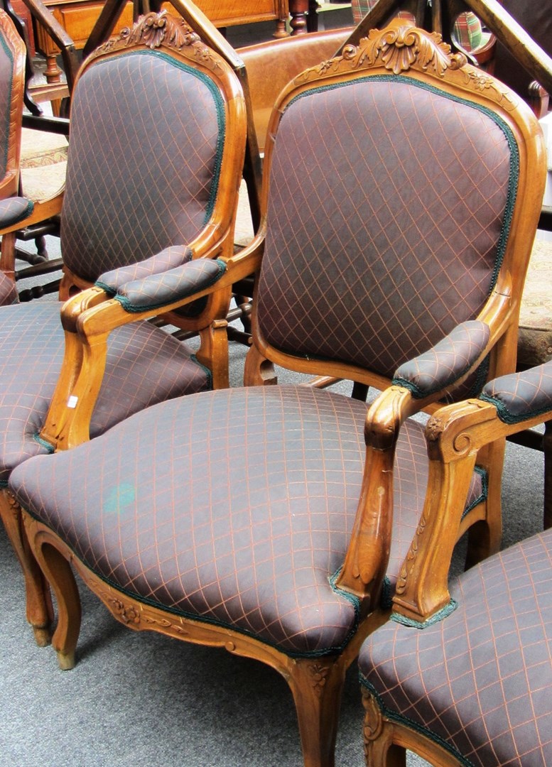 Appraisal: A pair of Louis XV style walnut framed fauteuils with