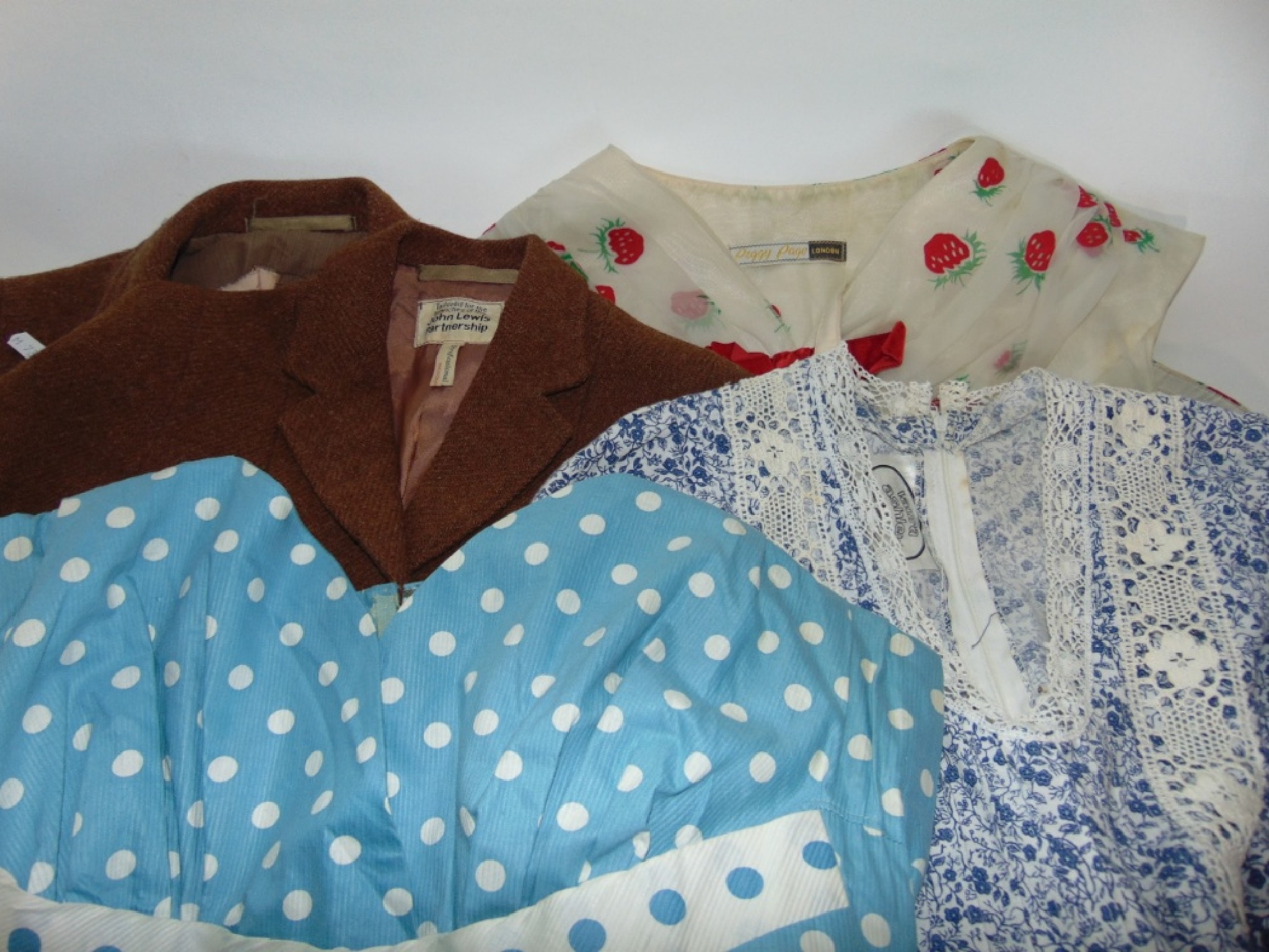 Appraisal: A selection of vintage clothing to include a child's brown