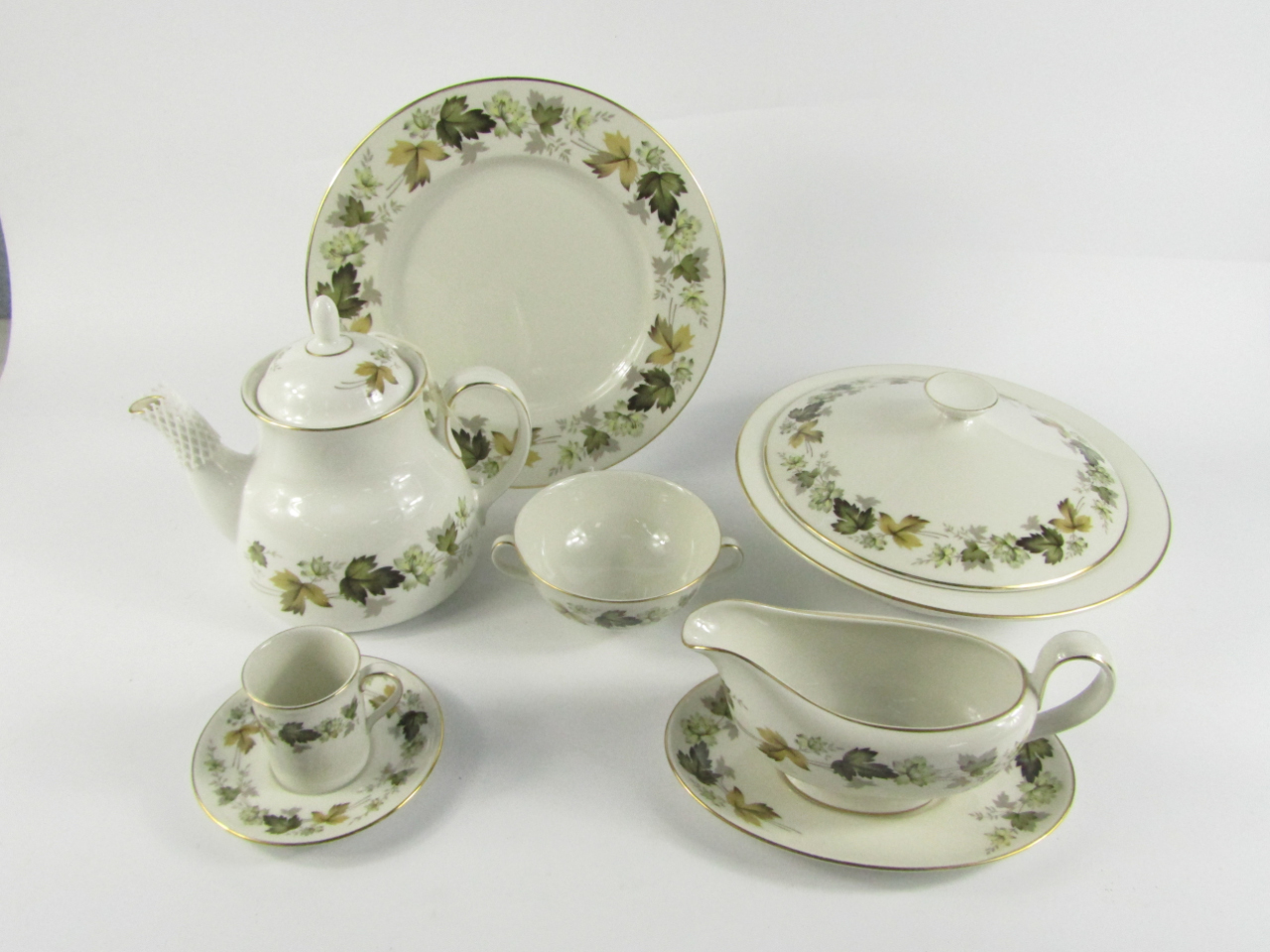 Appraisal: A Royal Doulton porcelain part dinner and coffee service decorated