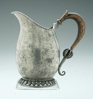 Appraisal: Nekrassof pewter pitcher wooden handle beaded openwork base Russian early