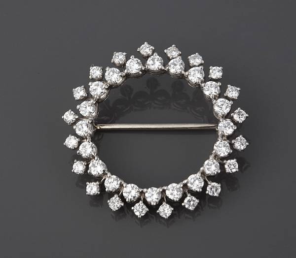 Appraisal: A diamond and white gold circle brooch estimated total diamond