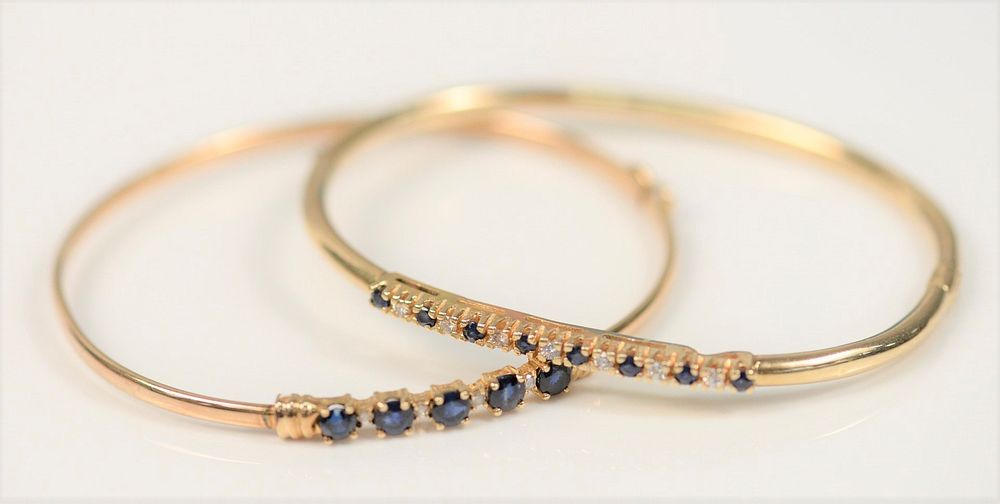 Appraisal: Two Karat Gold Bangle Bracelets each set with blue sapphires