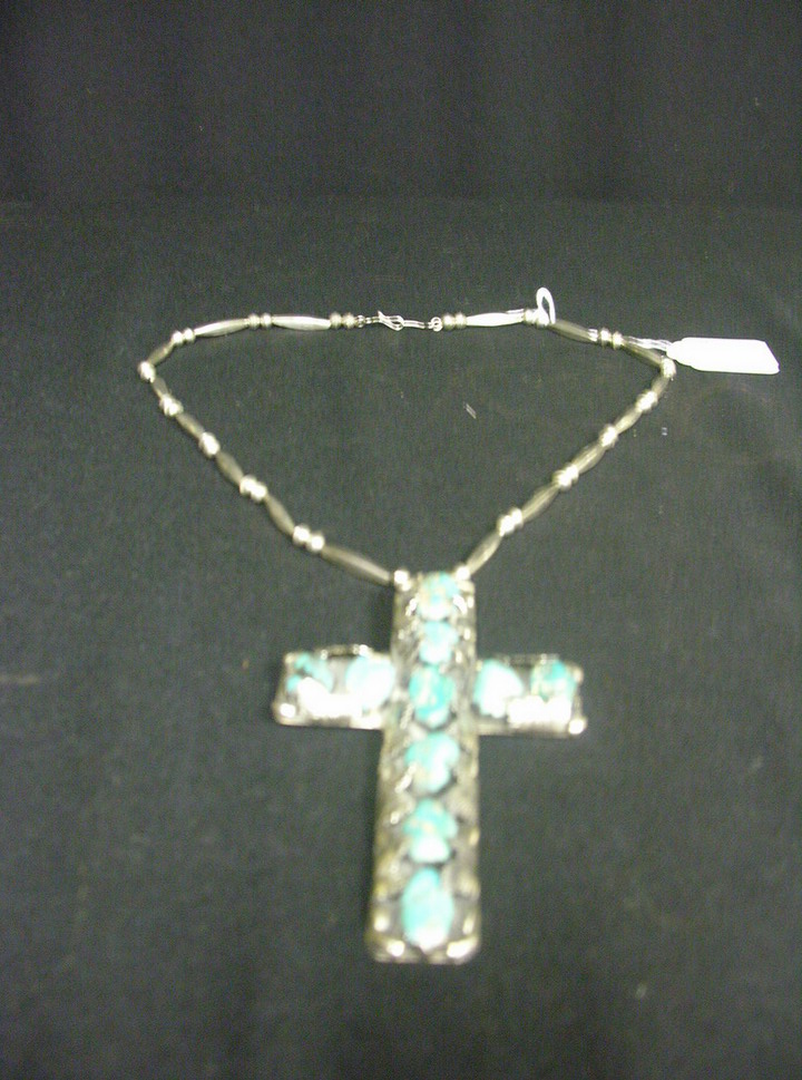 Appraisal: TURQUOISE SILVER CROSS NECKLACE Large turquoise stones mounted on unmarked