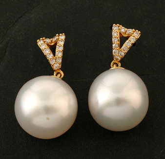 Appraisal: A pair of South Sea pearl and diamond earrings Each