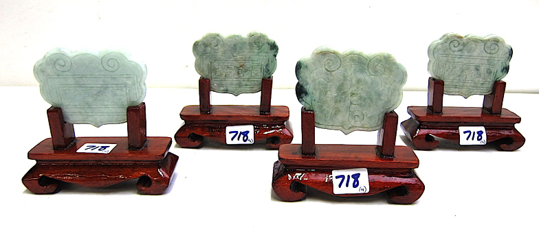 Appraisal: FOUR CHINESE CARVED NEPHRITE JADE PLAQUES on wood carved conforming