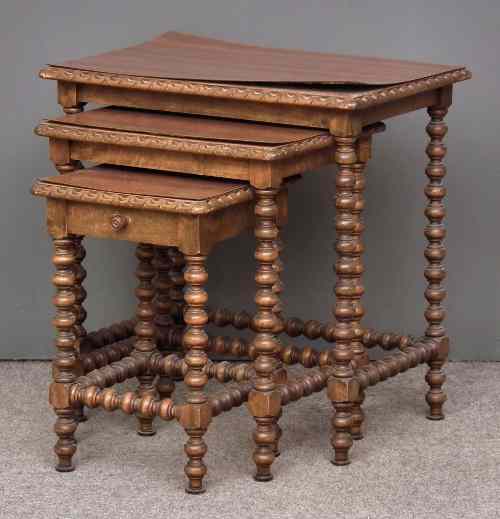 Appraisal: A nest of three French walnut rectangular occasional tables with