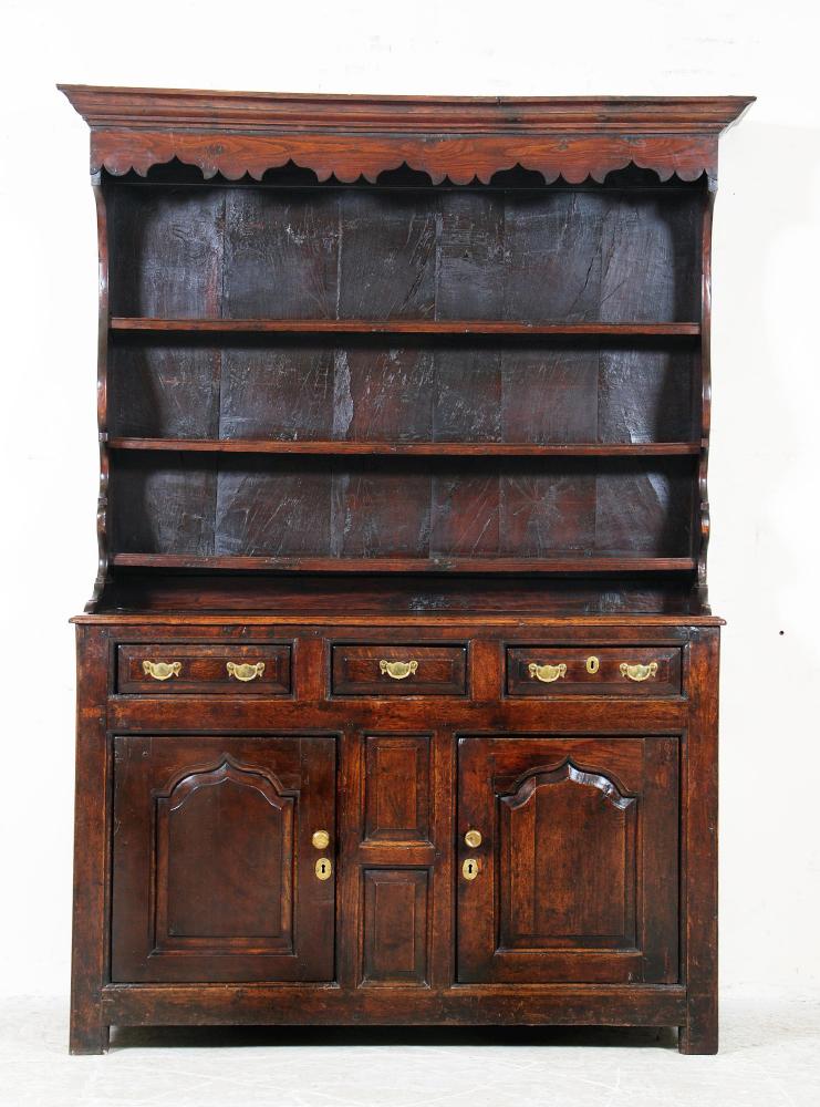 Appraisal: A GEORGE III OAK ENCLOSED DRESSER th century the boarded