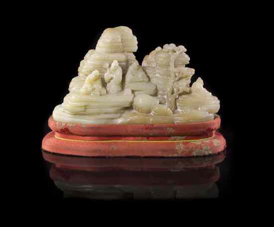 Appraisal: A Chinese Carved Soapstone Figural Group of opaque cream and