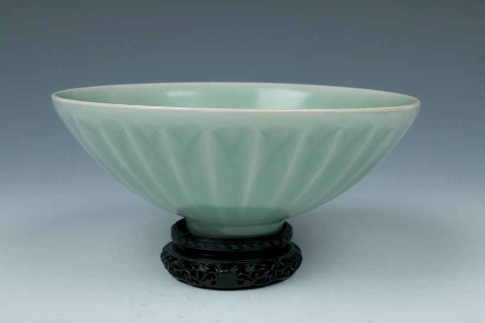 Appraisal: LONGQUAN CELADON LOTUS BOWL SONG The rounded sides lightly molded