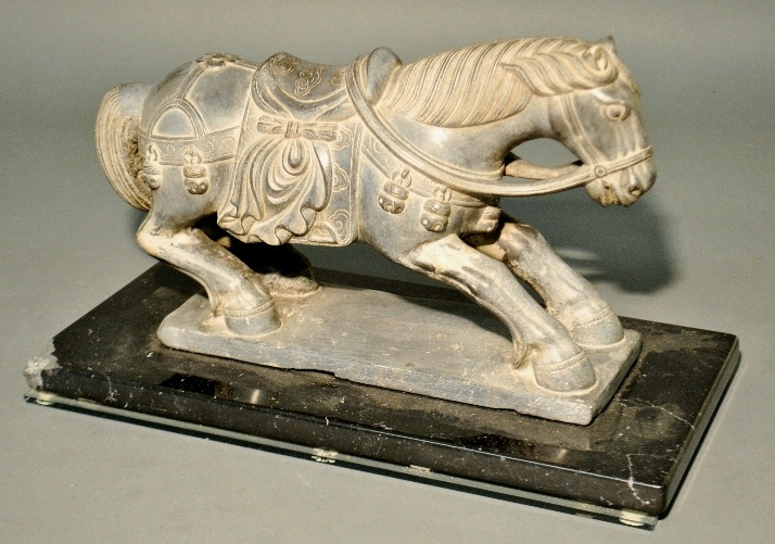 Appraisal: - Chinese Han style carved stone horse with ceremonial saddle