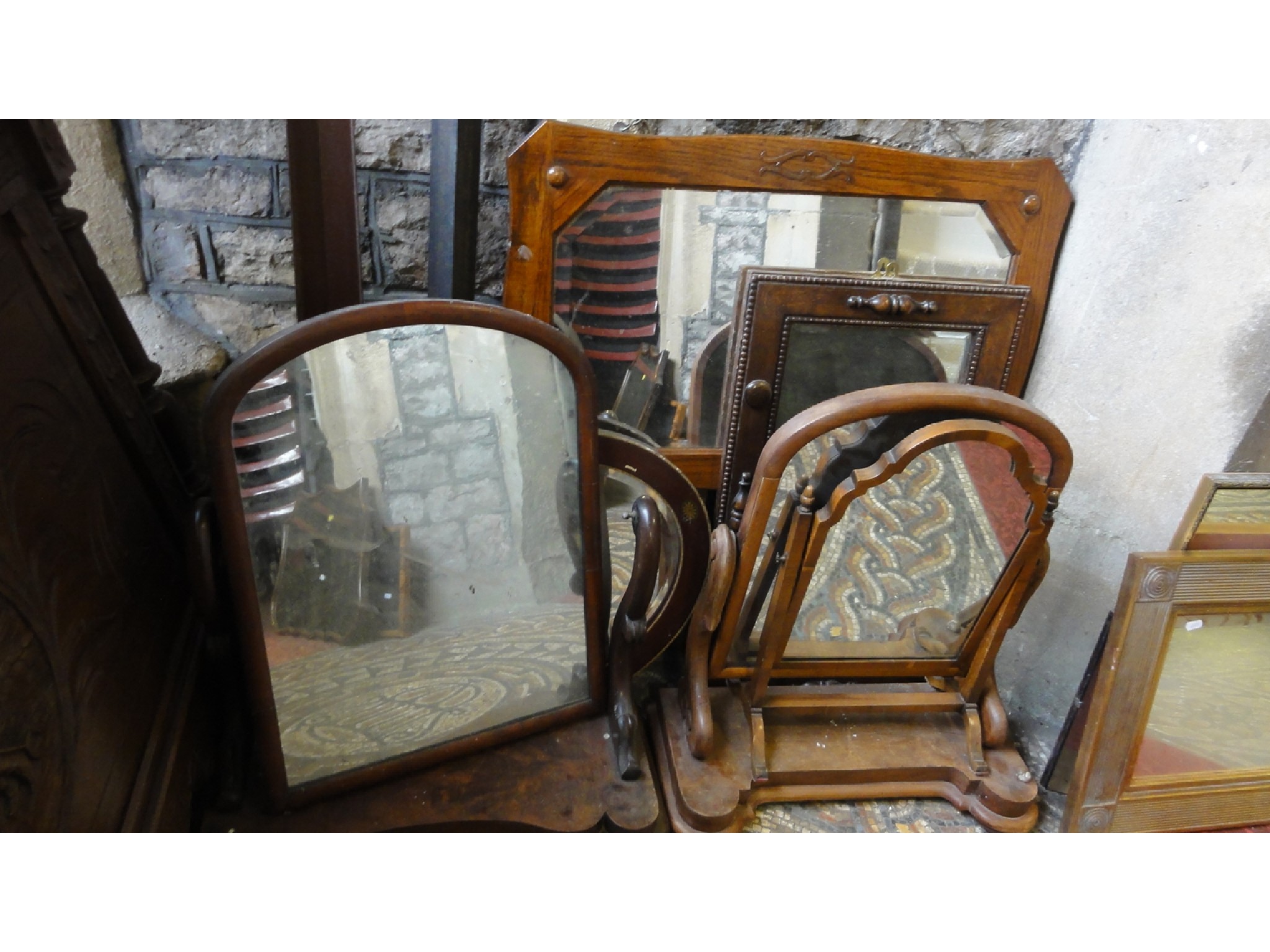 Appraisal: Two Victorian mahogany toilet mirrors of arched form with shaped