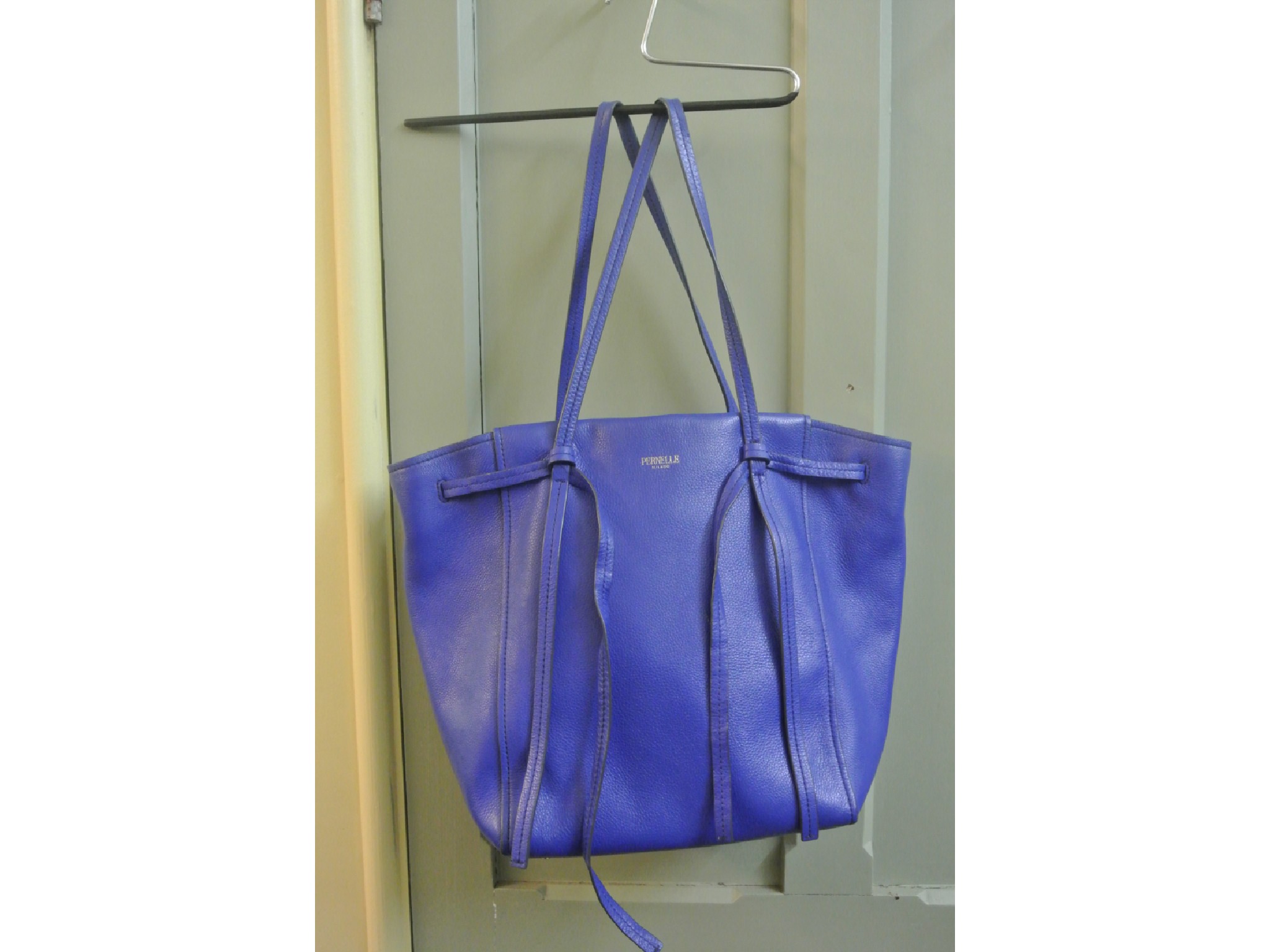 Appraisal: A Pernelle blue leather handbag with storage compartments