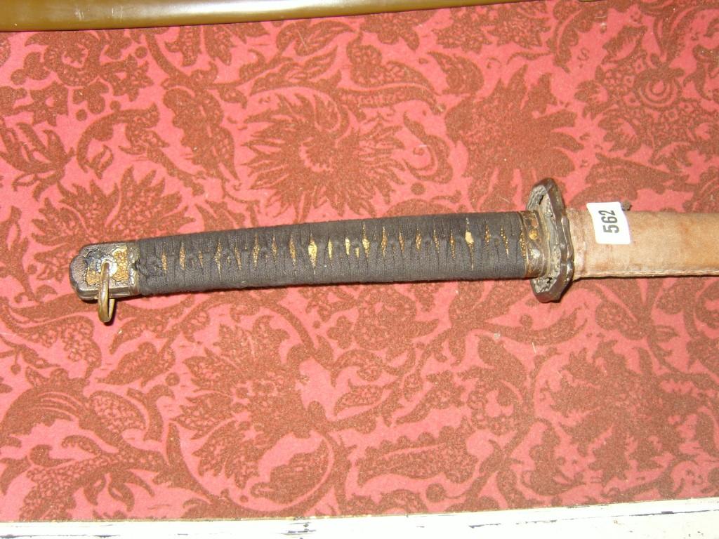 Appraisal: A Japanese Officers sword with leather scabbard pierced and decorated